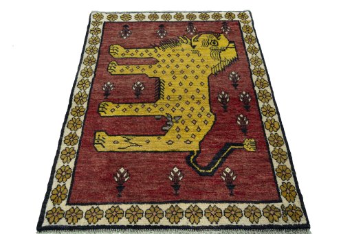 Surface texture of 2000s Persian Gabbeh rug with natural Wool and intricate pattern