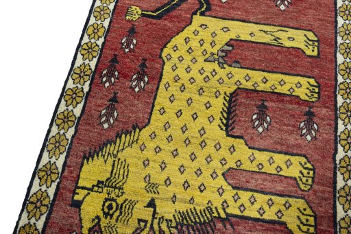 Backside of handmade 2000s Persian Gabbeh rug showing knot structure and weave density