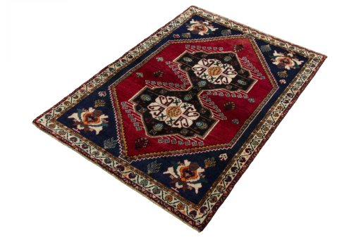 Corner detail of 2000s Persian Gabbeh rug showing border pattern and Wool pile