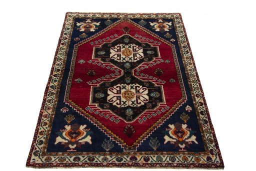 Surface texture of 2000s Persian Gabbeh rug with natural Wool and intricate pattern
