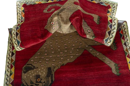 Corner detail of 2000s Persian Gabbeh rug showing border pattern and Wool pile