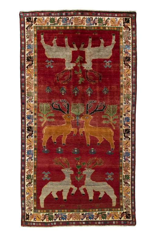 Full view of 2000s Persian Gabbeh rug from Iran / Persia, 283 × 153 cm in Red tones