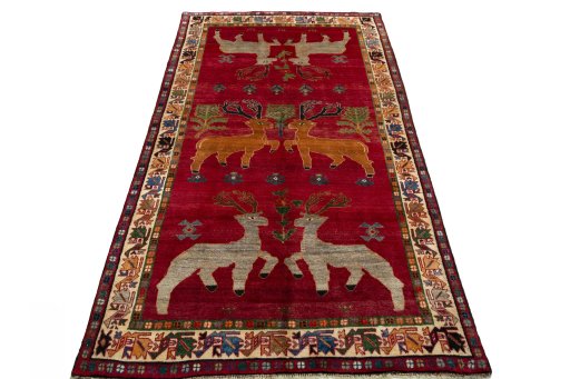 Surface texture of 2000s Persian Gabbeh rug with natural Wool and intricate pattern