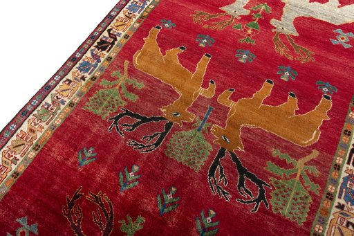 Backside of handmade 2000s Persian Gabbeh rug showing knot structure and weave density