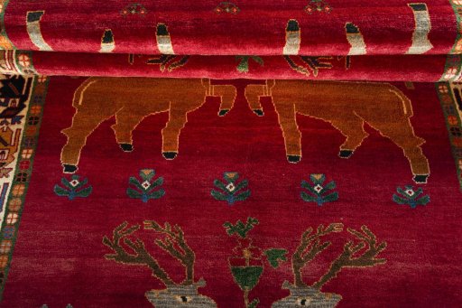 Full view of 2000s Persian Gabbeh rug from Iran / Persia, 283 × 153 cm in Red tones