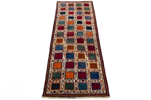 Surface texture of 2000s Persian Gabbeh rug with natural Wool and intricate pattern