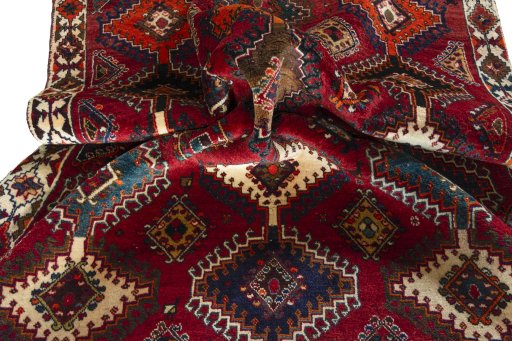Corner detail of 2000s Persian Gabbeh rug showing border pattern and Wool pile