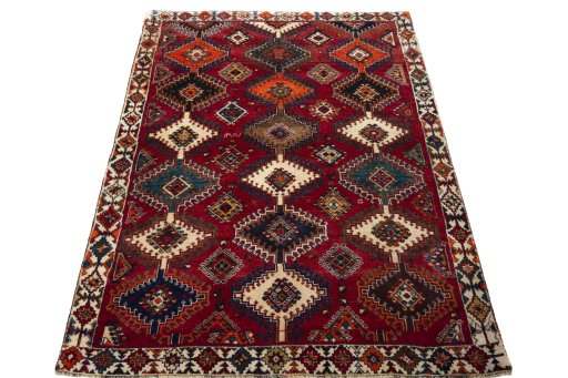 Surface texture of 2000s Persian Gabbeh rug with natural Wool and intricate pattern