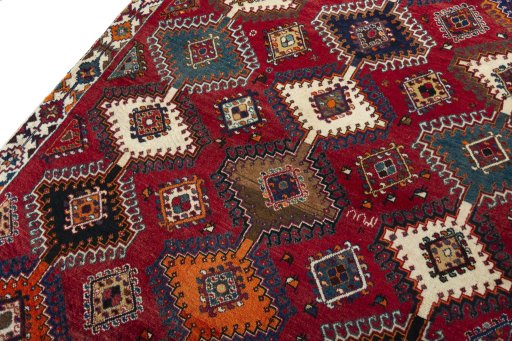 Backside of handmade 2000s Persian Gabbeh rug showing knot structure and weave density