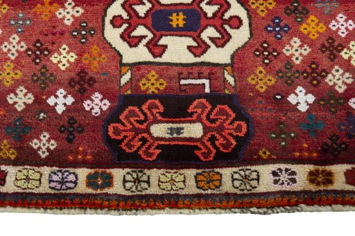 Backside of handmade 2000s Persian Gabbeh rug showing knot structure and weave density