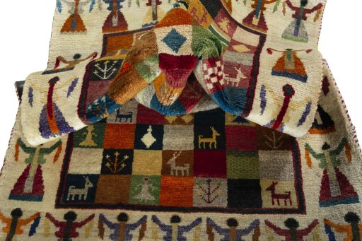 Corner detail of 2000s Persian Gabbeh rug showing border pattern and Wool pile