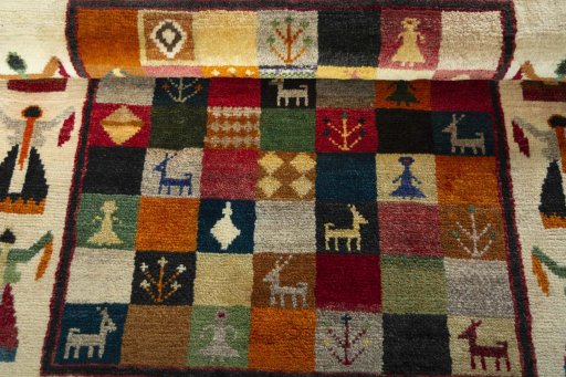 Full view of 2000s Persian Gabbeh rug from Iran / Persia, 125 × 81 cm in Multi Color tones