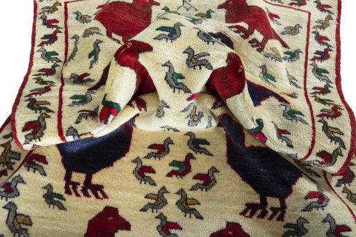 Corner detail of 2000s Persian Gabbeh rug showing border pattern and Wool pile