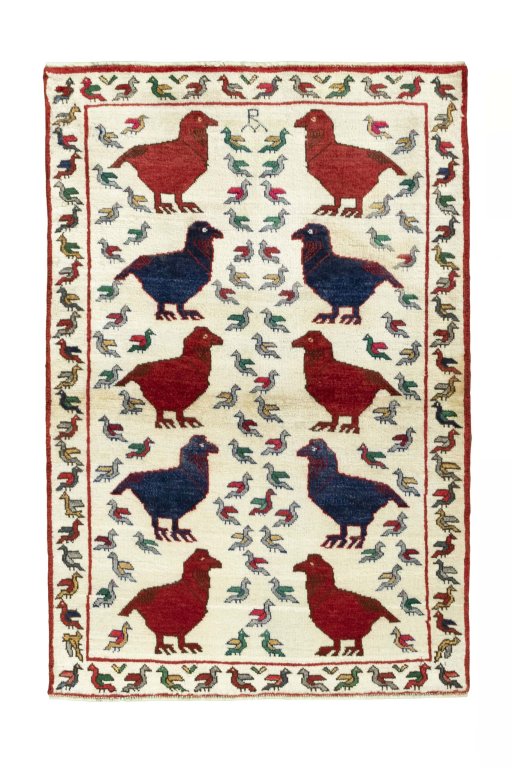 Full view of 2000s Persian Gabbeh rug from Iran / Persia, 152 × 103 cm in Beige tones