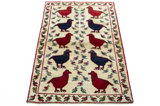 Surface texture of 2000s Persian Gabbeh rug with natural Wool and intricate pattern