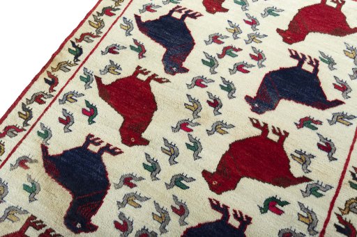 Backside of handmade 2000s Persian Gabbeh rug showing knot structure and weave density