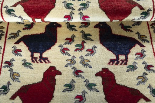 Full view of 2000s Persian Gabbeh rug from Iran / Persia, 152 × 103 cm in Beige tones