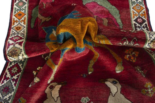 Corner detail of 2000s Persian Gabbeh rug showing border pattern and Wool pile