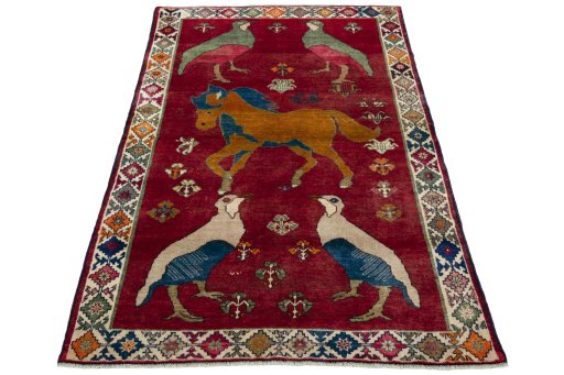 Surface texture of 2000s Persian Gabbeh rug with natural Wool and intricate pattern