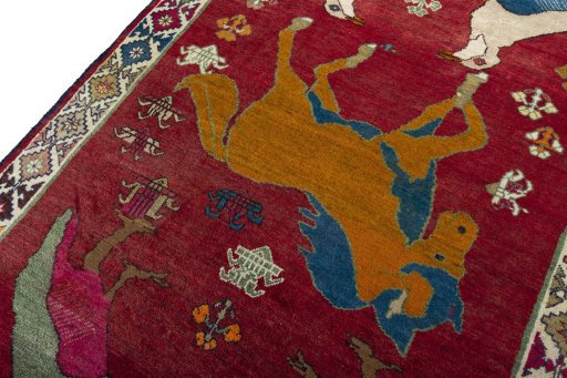 Backside of handmade 2000s Persian Gabbeh rug showing knot structure and weave density