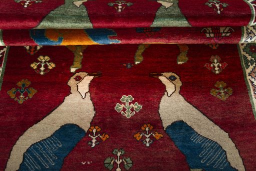 Full view of 2000s Persian Gabbeh rug from Iran / Persia, 227 × 140 cm in Red tones