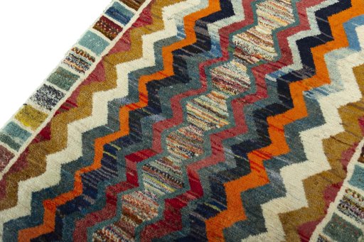 Backside of handmade 2000s Persian Gabbeh rug showing knot structure and weave density