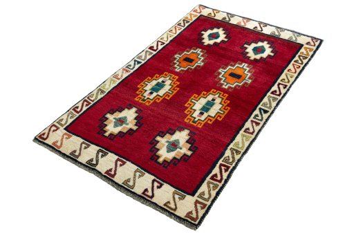 Corner detail of 2000s Persian Gabbeh rug showing border pattern and Wool pile