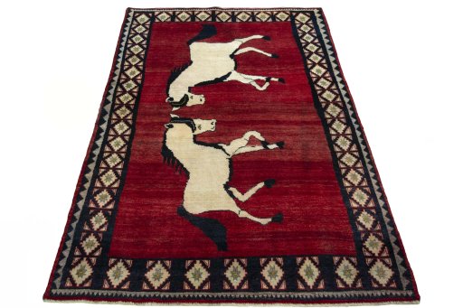Surface texture of 2000s Persian Gabbeh rug with natural Wool and intricate pattern
