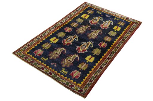 Corner detail of 2000s Persian Gabbeh rug showing border pattern and Wool pile