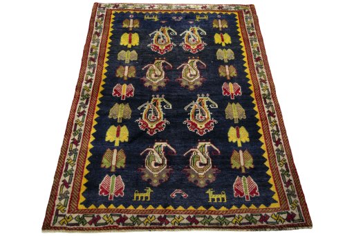 Surface texture of 2000s Persian Gabbeh rug with natural Wool and intricate pattern