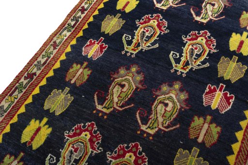 Backside of handmade 2000s Persian Gabbeh rug showing knot structure and weave density
