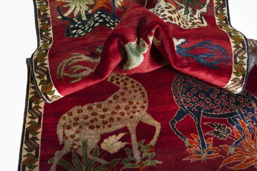 Corner detail of 2000s Persian Gabbeh rug showing border pattern and Wool pile