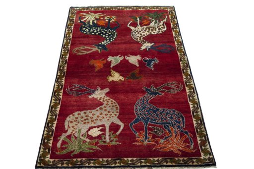 Surface texture of 2000s Persian Gabbeh rug with natural Wool and intricate pattern