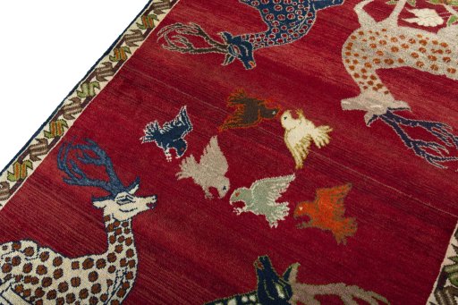 Backside of handmade 2000s Persian Gabbeh rug showing knot structure and weave density