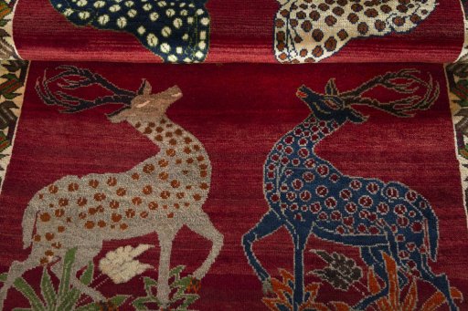 Full view of 2000s Persian Gabbeh rug from Iran / Persia, 190 × 116 cm in Red tones