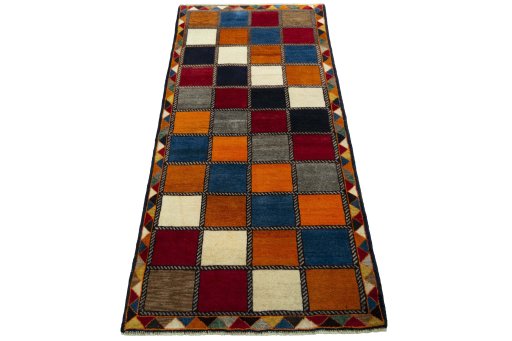 Surface texture of 2000s Persian Gabbeh rug with natural Wool and intricate pattern