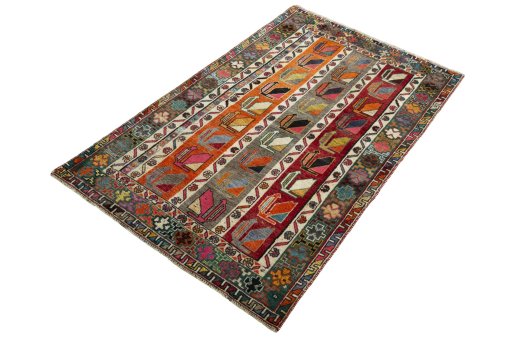 Corner detail of 2000s Persian Gabbeh rug showing border pattern and Wool pile