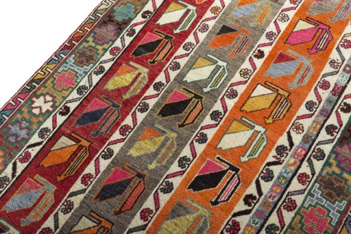Backside of handmade 2000s Persian Gabbeh rug showing knot structure and weave density