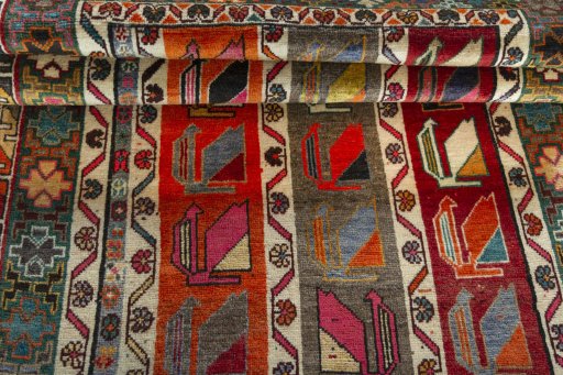 Full view of 2000s Persian Gabbeh rug from Iran / Persia, 177 × 113 cm in Multi Color tones