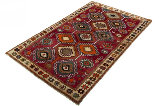 Corner detail of 2000s Persian Gabbeh rug showing border pattern and Wool pile