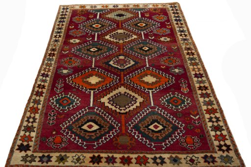Surface texture of 2000s Persian Gabbeh rug with natural Wool and intricate pattern