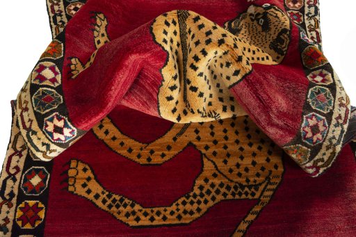 Corner detail of 2000s Persian Gabbeh rug showing border pattern and Wool pile