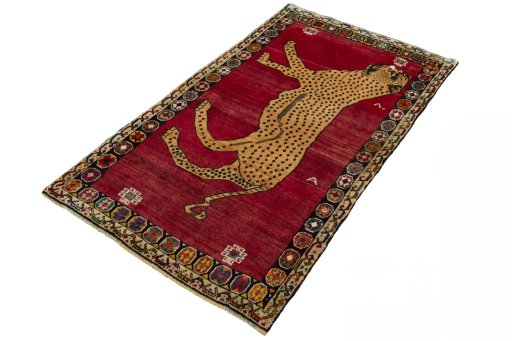 Corner detail of 2000s Persian Gabbeh rug showing border pattern and Wool pile