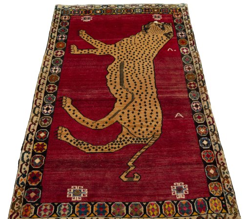 Surface texture of 2000s Persian Gabbeh rug with natural Wool and intricate pattern