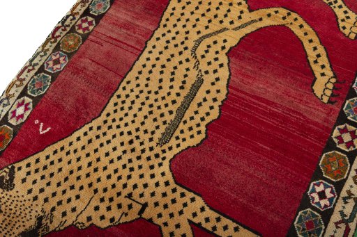 Backside of handmade 2000s Persian Gabbeh rug showing knot structure and weave density