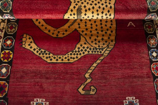 Full view of 2000s Persian Gabbeh rug from Iran / Persia, 217 × 122 cm in Red tones