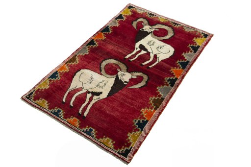 Corner detail of 2000s Persian Gabbeh rug showing border pattern and Wool pile