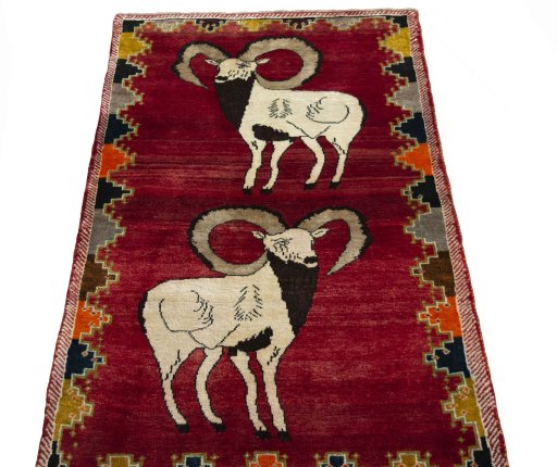 Surface texture of 2000s Persian Gabbeh rug with natural Wool and intricate pattern