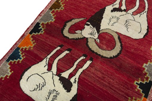 Backside of handmade 2000s Persian Gabbeh rug showing knot structure and weave density