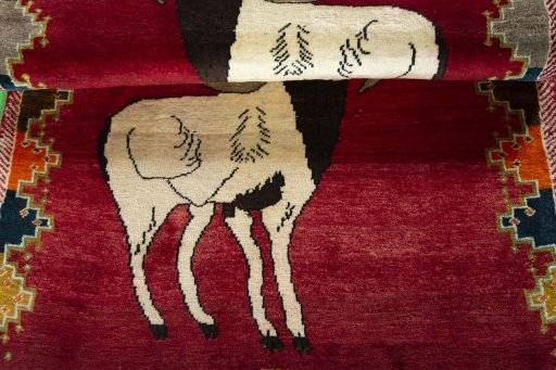 Full view of 2000s Persian Gabbeh rug from Iran / Persia, 172 × 104 cm in Red tones